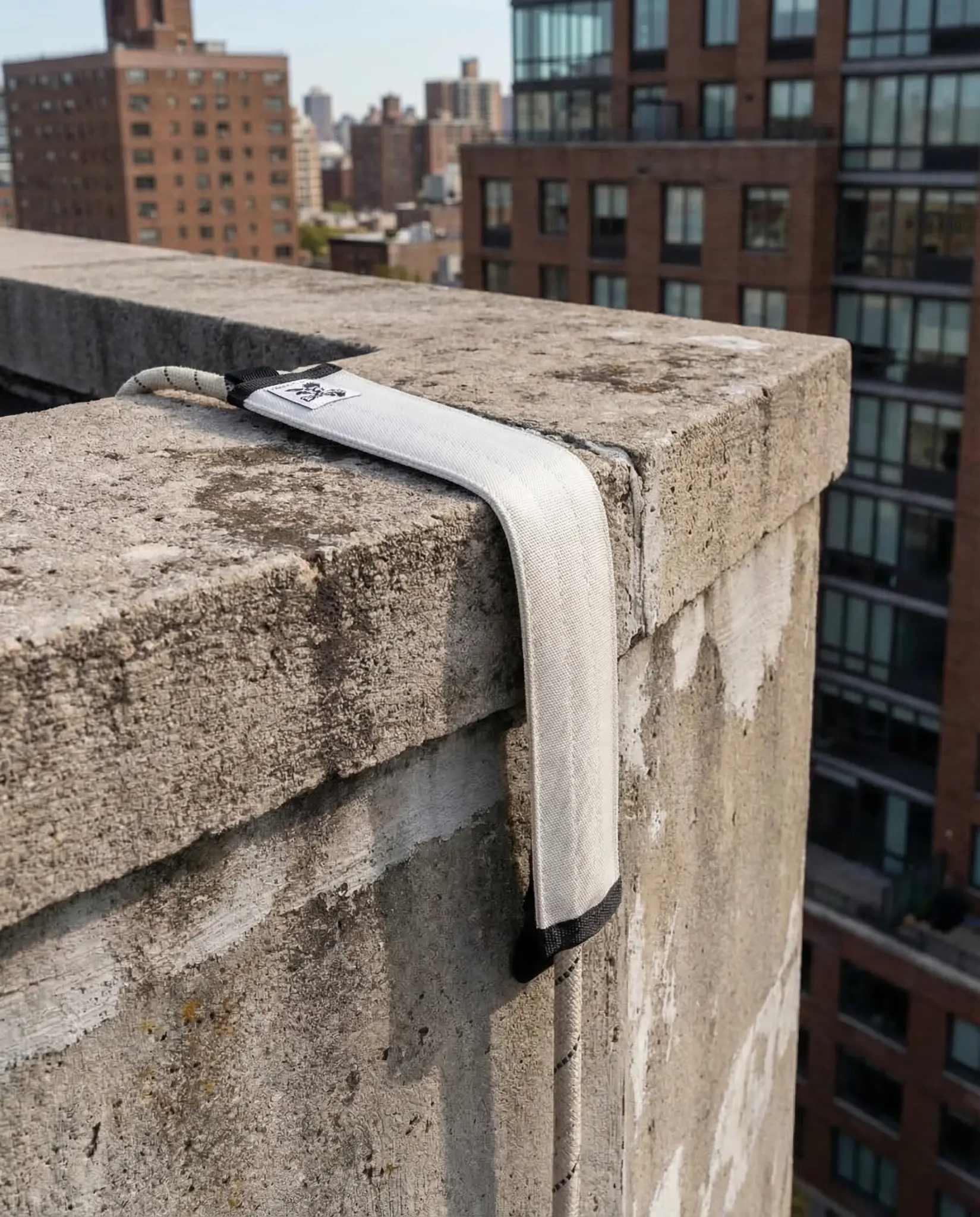 Rope protector draped over a rooftop edge with New York skyline in the background