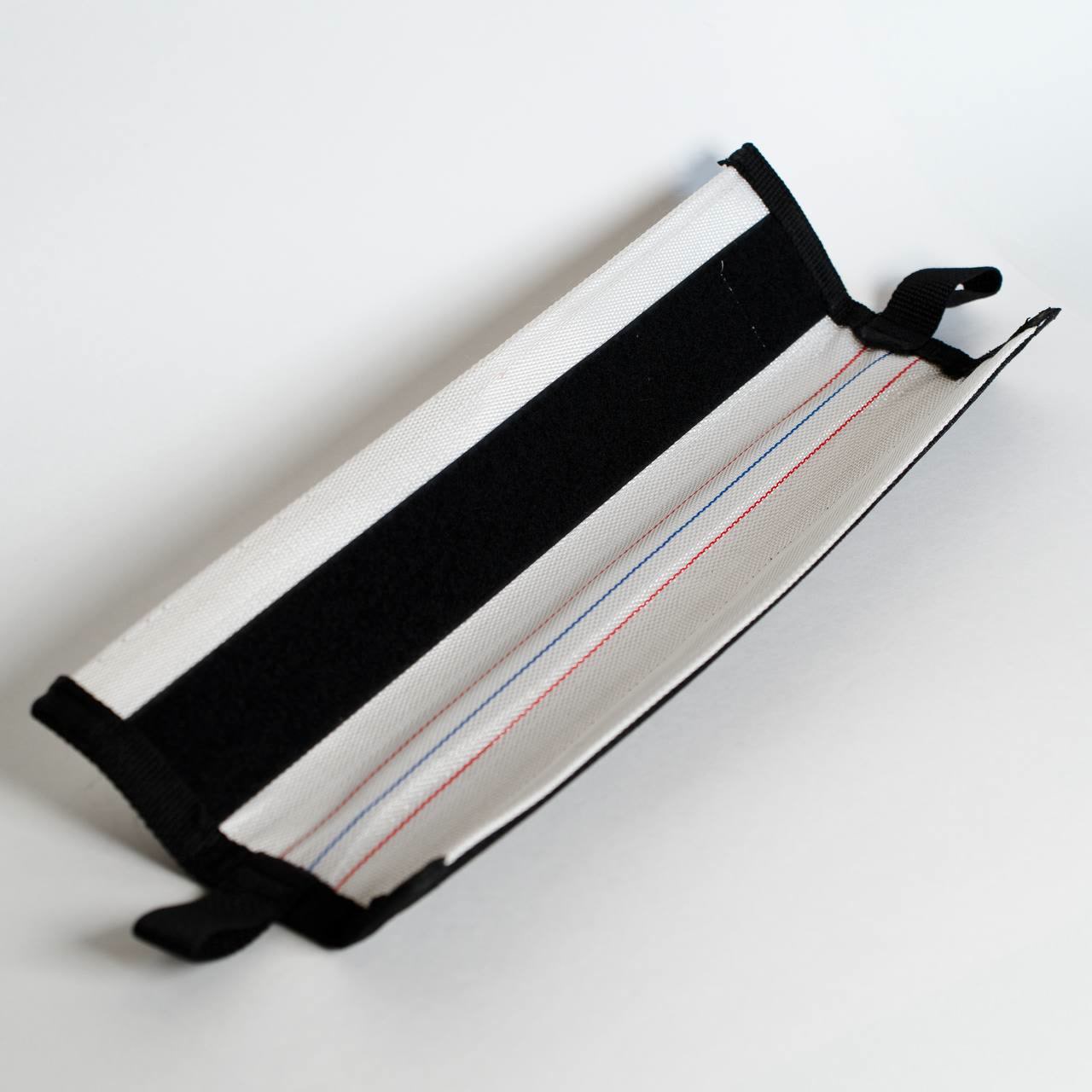 Studio photo of the rope protector open with hook-and-loop visible